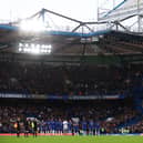 Both teams and fans stand for a minute of applause in memory of former footballer, Roger Hunt who recently passed away prior to the Premier League match between Chelsea and Southampton at Stamford Bridge on October 02, 2021 in London, England. (Photo by Clive Rose/Getty Images)