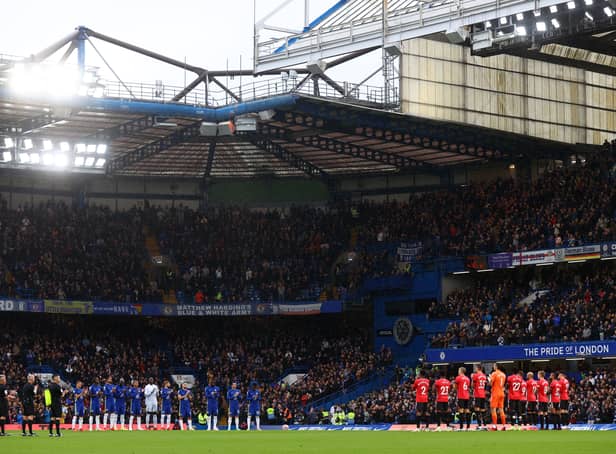 <p>Both teams and fans stand for a minute of applause in memory of former footballer, Roger Hunt who recently passed away prior to the Premier League match between Chelsea and Southampton at Stamford Bridge on October 02, 2021 in London, England. (Photo by Clive Rose/Getty Images)</p>