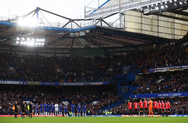 Both teams and fans stand for a minute of applause in memory of former footballer, Roger Hunt who recently passed away prior to the Premier League match between Chelsea and Southampton at Stamford Bridge on October 02, 2021 in London, England. (Photo by Clive Rose/Getty Images)