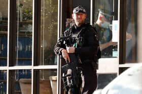A police firearms officer is seen at the scene of a stabbing incident at Belfairs Methodist Church in Leigh-on-Sea, a district of Southend-on-Sea, in southeast England on October 15, 2021. - Conservative British lawmaker David Amess was killed on Friday after being stabbed "multiple times" during an event in his local constituency in southeast England, in the second death of a UK politician while meeting voters since 2016. Local police did not name Amess but said a man had been arrested "on suspicion (of) murder" after the stabbing in Leigh-on-Sea. (Photo by Tolga Akmen / AFP) (Photo by TOLGA AKMEN/AFP via Getty Images)