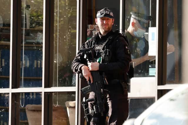 A police firearms officer is seen at the scene of a stabbing incident at Belfairs Methodist Church in Leigh-on-Sea, a district of Southend-on-Sea, in southeast England on October 15, 2021. - Conservative British lawmaker David Amess was killed on Friday after being stabbed "multiple times" during an event in his local constituency in southeast England, in the second death of a UK politician while meeting voters since 2016. Local police did not name Amess but said a man had been arrested "on suspicion (of) murder" after the stabbing in Leigh-on-Sea. (Photo by Tolga Akmen / AFP) (Photo by TOLGA AKMEN/AFP via Getty Images)