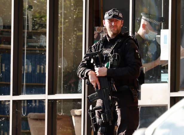 <p>A police firearms officer is seen at the scene of a stabbing incident at Belfairs Methodist Church in Leigh-on-Sea, a district of Southend-on-Sea, in southeast England on October 15, 2021. - Conservative British lawmaker David Amess was killed on Friday after being stabbed "multiple times" during an event in his local constituency in southeast England, in the second death of a UK politician while meeting voters since 2016. Local police did not name Amess but said a man had been arrested "on suspicion (of) murder" after the stabbing in Leigh-on-Sea. (Photo by Tolga Akmen / AFP) (Photo by TOLGA AKMEN/AFP via Getty Images)</p>