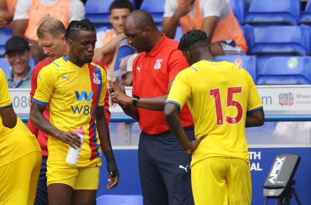 Patrick Vieira, Manager of Crystal Palace gives instructions to Wilfried Zaha and Jeffrey Schlupp (Photo by Paul Harding/Getty Images)