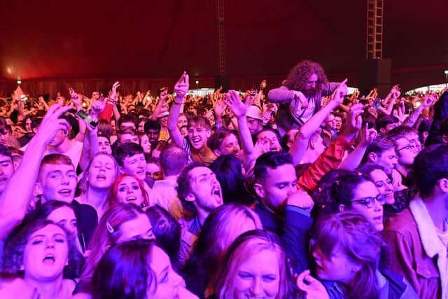 Fans watch Blossom perform at a live music concert hosted by Festival Republic in Sefton Park in Liverpool, north-west England on May 2, 2021 (Photo by PAUL ELLIS/AFP via Getty Images)
