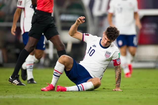 Christian Pulisic #10 of United States gathers himself after being knocked to the ground (Photo by Brett Carlsen/Getty Images)