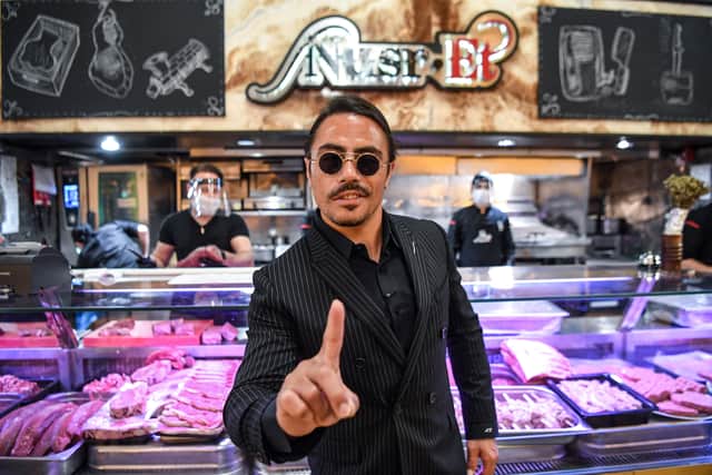 Turkish restaurateur Nusret Gokce, also known as ‘Salt Bae’, poses for photos at his restaurant ‘Nusr-Et’ at the Grand Bazaar, Istanbul. Credit: OZAN KOSE/AFP via Getty Images