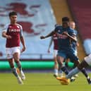  Thomas Partey of Arsenal is tackled by Marvelous Nakamba of Aston Villa   during the Premier League match (Photo by Catherine Ivill/Getty Images)