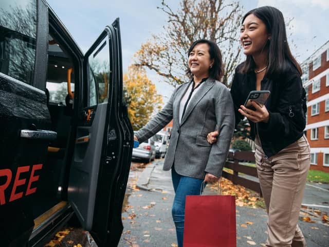 Passengers getting in a Free Now cab. Credit: Free Now