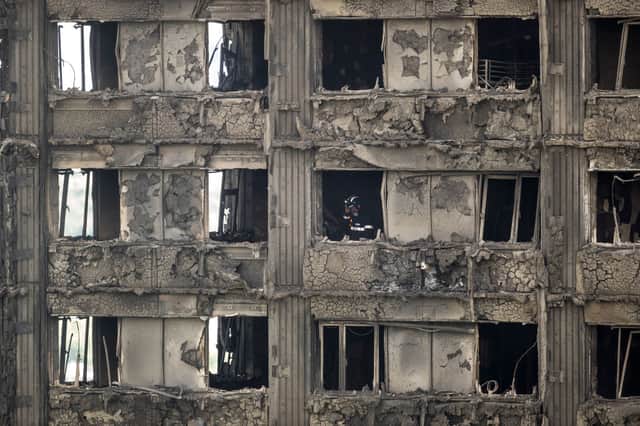  Firefighters inspect the blackened interior of Grenfell Tower on June 15, 2017. Credit: Dan Kitwood/Getty Images