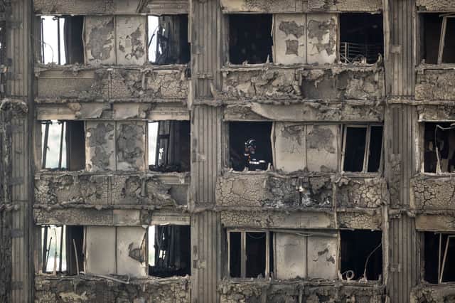  Firefighters inspect the blackened interior of Grenfell Tower on June 15, 2017. Credit: Dan Kitwood/Getty Images