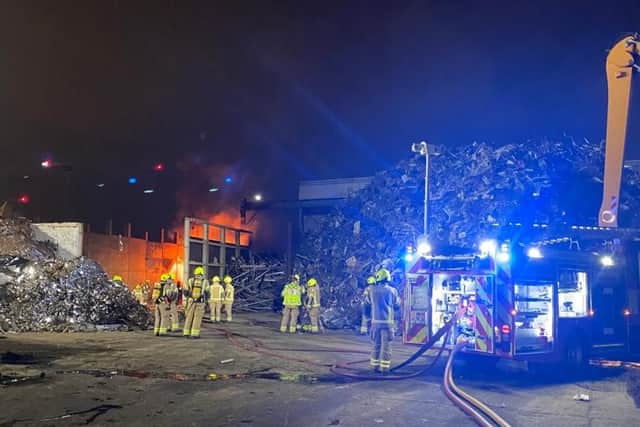 Firefighters at the recycling plant in Canning Town. Credit: LFB