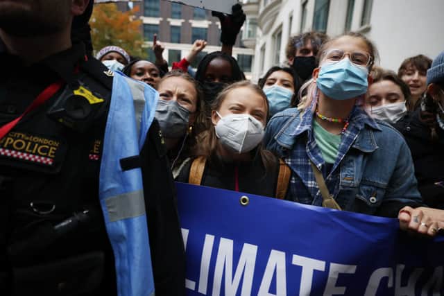 Climate activist Greta Thunberg joins a protest outside the headquarters of Standard Chartered. Photo by Dan Kitwood/Getty Images