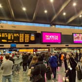 COP26 delegates waiting for trains during the travel chaos at Euston. Credit: Finley Dyer