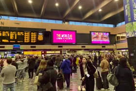 COP26 delegates waiting for trains during the travel chaos at Euston. Credit: Finley Dyer