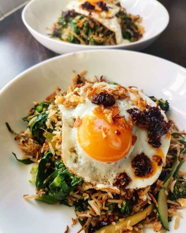 The Cookbook Circle’s crispy fried rice with ginger and garlic greens and an egg. Credit: The Cookbook Circle