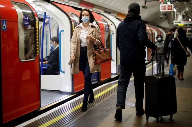 <p>Commuters use the Tube. Credit: TOLGA AKMEN/AFP via Getty Images</p>
