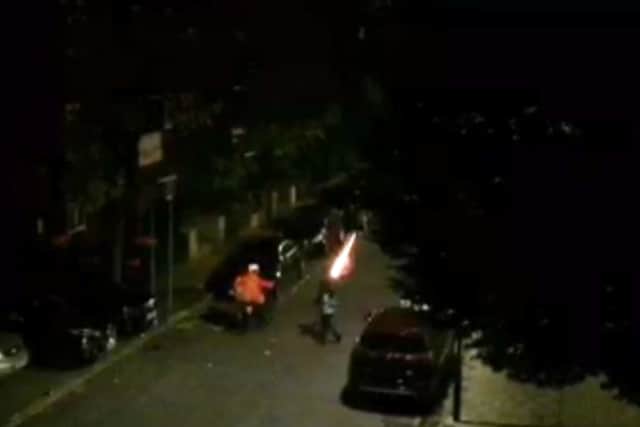 A teen fires a firework right next to the Just Eat driver. Credit: SWNS