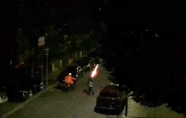 A teen fires a firework right next to the Just Eat driver. Credit: SWNS