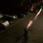 Shocking video footage shows teenagers shooting FIREWORKS at each other - catching a Just Eat delivery driver in the crossfire. Credit: SWNS