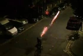 Shocking video footage shows teenagers shooting FIREWORKS at each other - catching a Just Eat delivery driver in the crossfire. Credit: SWNS