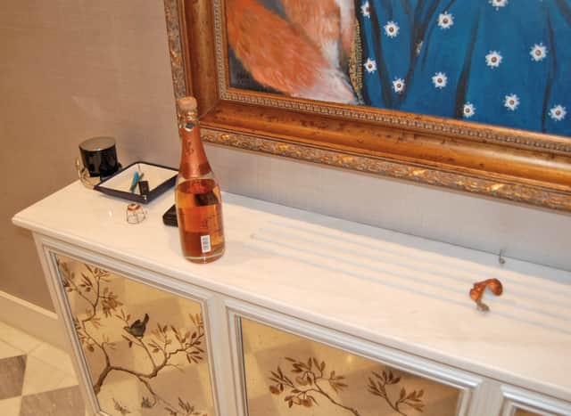 An opened £500 bottle of Cristal champagne left by burglars at the home of the late Leicester City FC chairman Thai billionaire Vichai Srivaddhanaprabha.