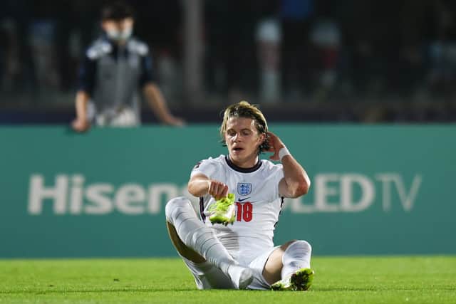 Conor Gallagher of England puts on his boot during the 2022 FIFA World Cup Qualifier (Photo by Alessandro Sabattini/Getty Images)