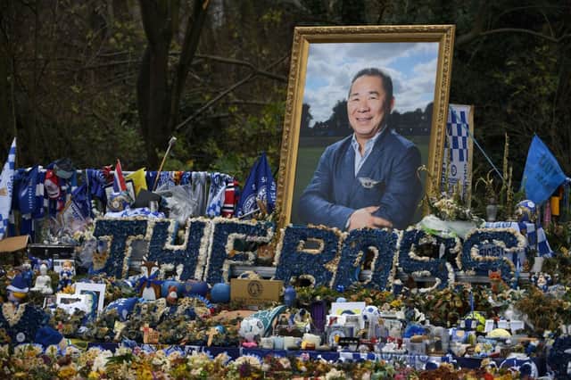 An image of Leicester City’s Thai chairman Vichai Srivaddhanaprabha is pictured amogst floral tributes left outside the King Power Stadium in Leicester. Burglars targeted his house after his death. Credit: Credit: PAUL ELLIS/AFP via Getty Images