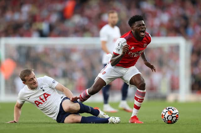 Thomas Partey of Arsenal is challenged by Oliver Skipp of Tottenham Hotspur  (Photo by Julian Finney/Getty Images)