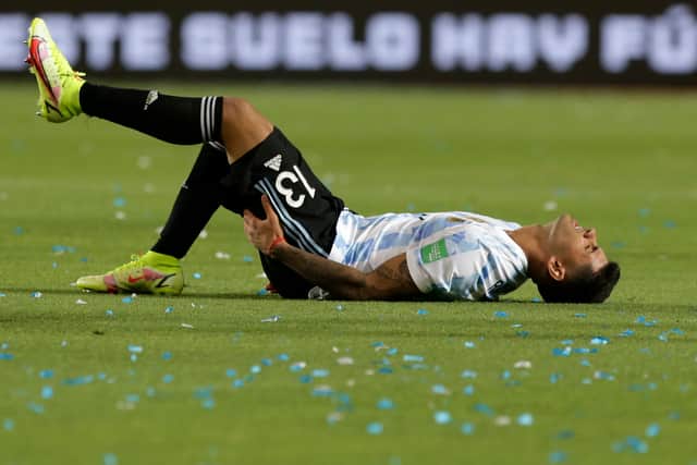 Cristian Romero of Argentina reacts after being injured during a match (Photo by Daniel Jayo/Getty Images)