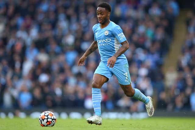 Raheem Sterling of Manchester City runs with the ball during the Premier League match (Photo by Alex Livesey/Getty Images)