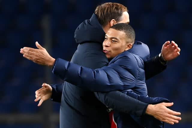 Paris Saint-Germain's French forward Kylian MBappe is cogratuled by Paris Saint-Germain's German head coach  Thomas Tuchel  (Photo by FRANCK FIFE / AFP) (Photo by FRANCK FIFE/AFP via Getty Images)