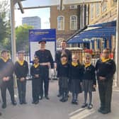 Darren Guttridge, right, headteacher at Edward Wilson Primary School, with some of his pupils in their school uniform.