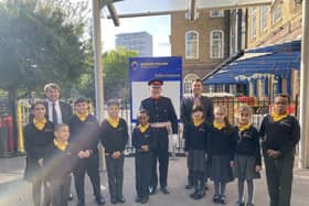 Darren Guttridge, right, headteacher at Edward Wilson Primary School, with some of his pupils in their school uniform.