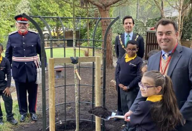 Darren, right, with pupils.