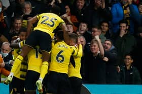 Watford's Senegalese midfielder Ismaila Sarr celebrates with team mates (Photo by IAN KINGTON/AFP via Getty Images)