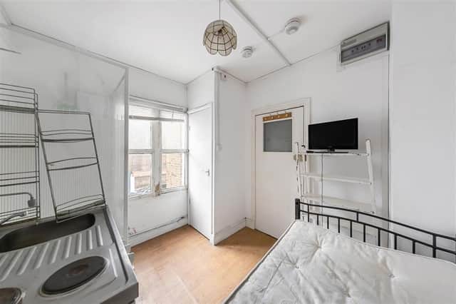The view from the bed, which includes the hot plates, sink, shower and toilet cupboard. Credit: Douglas&Gordon/RightMove
