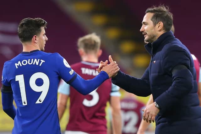 Chelsea’s English head coach Frank Lampard (R) and Chelsea’s English midfielder Mason Mount (L) shake hands (Photo by ALEX LIVESEY/POOL/AFP via Getty Images)