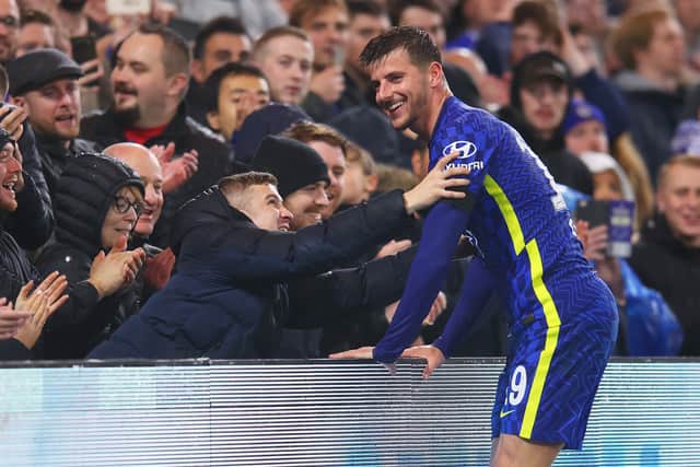 Mason Mount of Chelsea reacts with a fan in the crowd (Photo by Catherine Ivill/Getty Images)