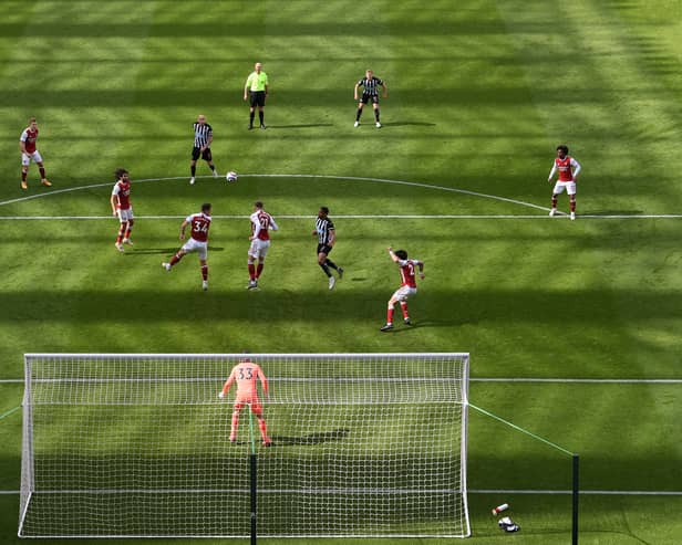 A general view of the action as the shadow lengthens across the pitch during the Premier League match (Photo by Stu Forster/Getty Images)