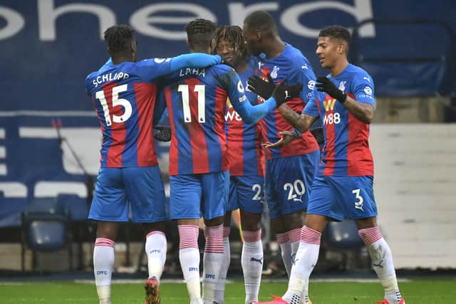 Wilfried Zaha of Crystal Palace celebrates with team mates (Photo by Rui Vieira - Pool/Getty Images)