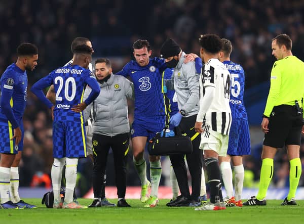 Ben Chilwell of Chelsea is helped off the pitch during the UEFA Champions League group H match (Photo by Catherine Ivill/Getty Images)