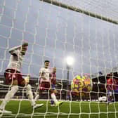 Matt Target (R) of Aston Villa scores their first goal past Vicente Guaita  (Photo by Ryan Pierse/Getty Images)