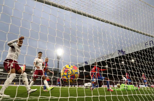 Matt Target (R) of Aston Villa scores their first goal past Vicente Guaita  (Photo by Ryan Pierse/Getty Images)