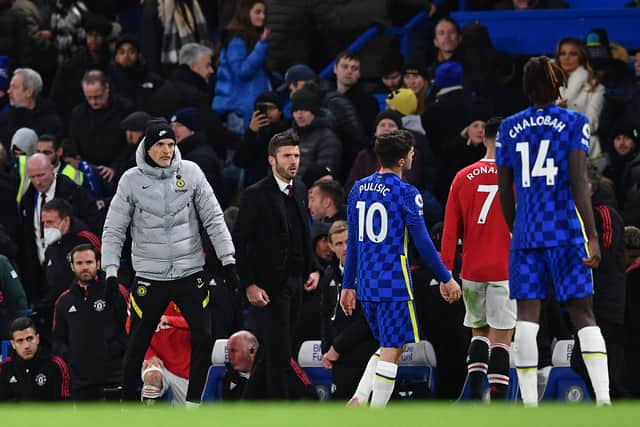 Chelsea's German head coach Thomas Tuchel (L) and Manchester United's English caretaker manager Michael Carrick  (Photo by BEN STANSALL/AFP via Getty Images)