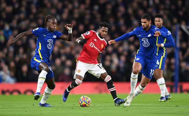 Fred of Manchester United battles for possession with Trevoh Chalobah (L) and Ruben Loftus- (Photo by Shaun Botterill/Getty Images )