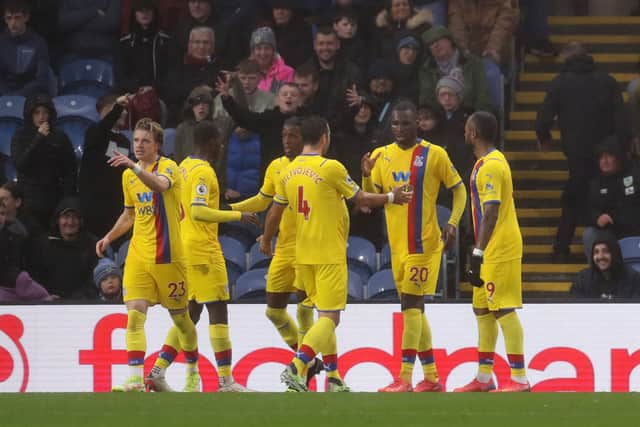Christian Benteke of Crystal Palace (2R) celebrates with teammates (Photo by Lewis Storey/Getty Images)