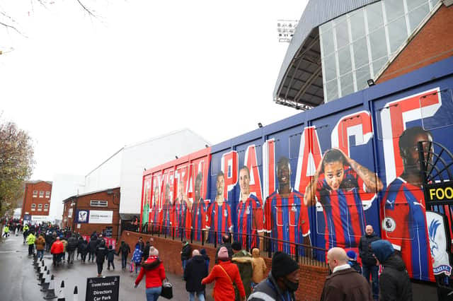 <p>Fans arrive at the stadium prior to the Premier League match  (Photo by Clive Rose/Getty Images)</p>