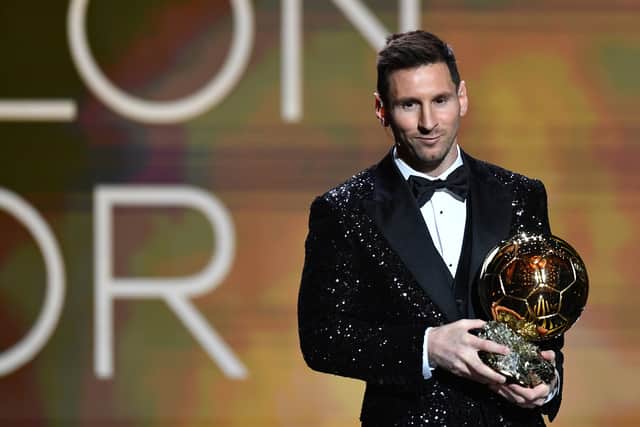 Lionel Messi collects the 2021 Ballon d’Or. Picture: Aurelien Meunier/Getty Images)