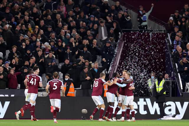 Michail Antonio of West Ham United celebrates with teammates after scoring a goal (Photo by Alex Pantling/Getty Images)