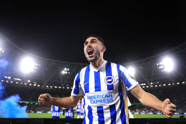 Neal Maupay of Brighton celebrates after scoring his sides first goal during the Premier League match between West Ham United and  Brighton & Hove Albion at London Stadium. Credit: Alex Pantling/Getty Images